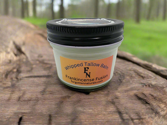Jar of Whipped Tallow Balm with Frankincense Fusion label on a white background